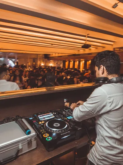 Another perspective of the DJ booth overlooking a packed venue. My experience includes handling large crowds at popular clubs.