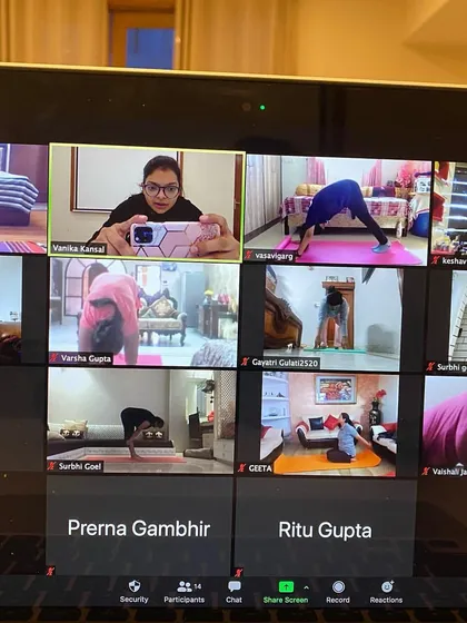 Another view of our deep stretch session. We focus on poses that release tension in the hips and hamstrings. I make sure to check in on everyone's form through the screen.