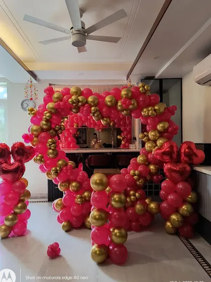Another angle of the heart-shaped balloon arch, showing the fullness of the arrangement. This type of freestanding decoration can be placed anywhere in your home or venue to create a central point for photos.