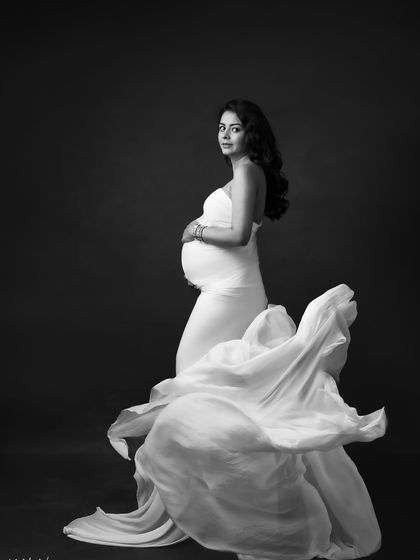 The power and grace of this fabric toss shot are amplified in black and white, creating a truly artistic and dramatic image.