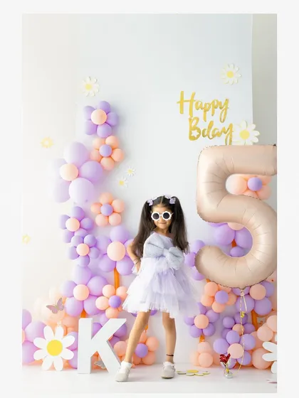 Celebrating a fifth birthday in style. For my themed birthday shoots, I love creating a fun and vibrant atmosphere where your child's personality can truly shine.