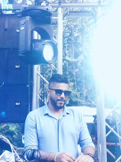 A candid shot from an outdoor event. Even in a relaxed setting, my focus is always on delivering the best possible musical experience.