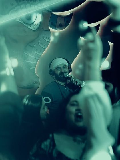 An artistic, double-exposure shot from a rager at Tipsy Bull, Koramangala.