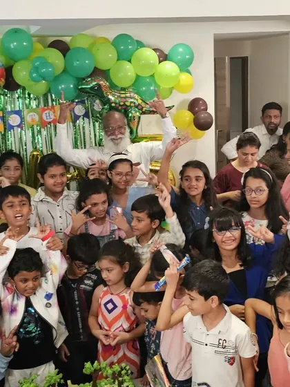 A group photo with all the kids and guests after a fantastic birthday magic show. Look at all those happy, smiling faces.