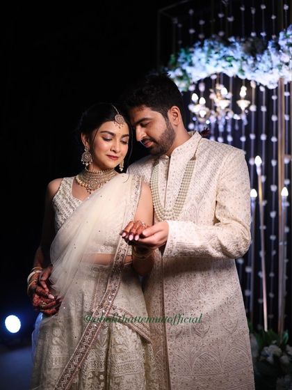 A romantic couple portrait from the ring exchange. The bride's makeup is flawless even in dramatic, low-light photography.