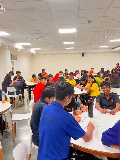 Students engaged in a collaborative writing activity at our Prometheus School workshop. We make learning fun, interactive, and team-oriented.
