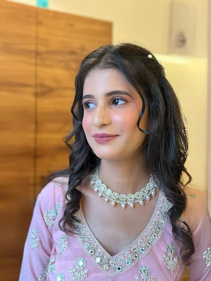 A candid shot that captures the elegance of this engagement look. The makeup is subtle enough to look natural but polished enough for photos.