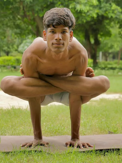 The Kukkutasana, or Rooster Pose, is an advanced arm balance performed with legs in lotus. It builds serious arm and core strength.