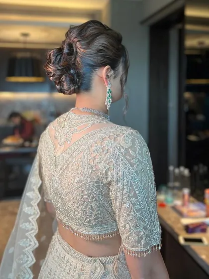 A close-up of the messy bun, showing the soft, romantic feel of the hairstyle.
