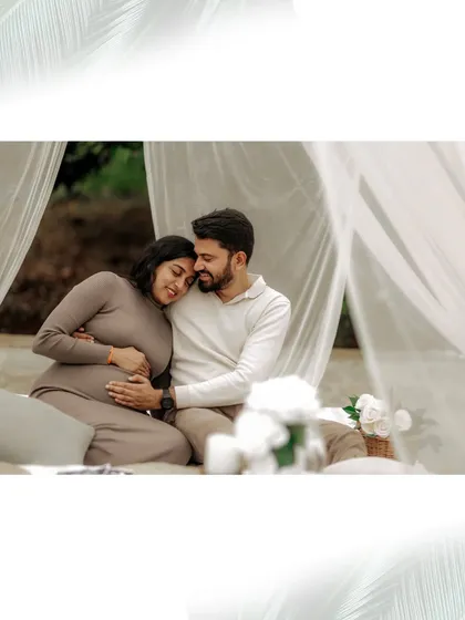 Here, I created a soft and serene atmosphere with simple white drapes for an intimate maternity session. The gentle embrace and quiet connection between the couple highlight the deep, personal emotions of their journey to parenthood.