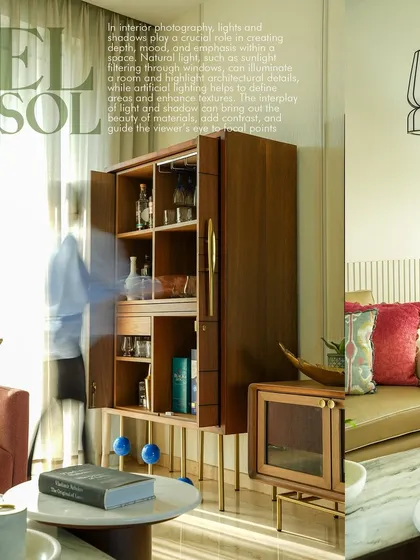 This image uses a creative overlay to combine a wide shot of a living room with text, similar to a magazine feature. It showcases the bar cabinet and overall room ambiance while adding a layer of editorial style to my portfolio.