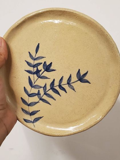 A beautiful and cute ceramic plate, hand-painted with a delicate blue foliage design and finished with a shiny glaze. Perfect for Diwali hampers or any special occasion.