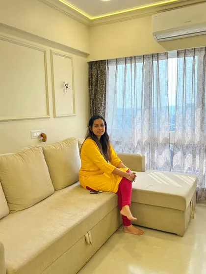 Relaxing in a bright and airy living space, a testament to how good design can create a peaceful atmosphere.