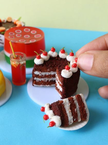 A slice of my miniature black forest cake, showing the layers of chocolate sponge and cream.