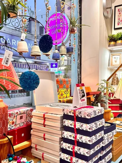 A glimpse of our store during the festive season. We have stacks of gift boxes ready to go, along with beautiful decor to make your home feel special.