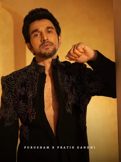 It is an honor to dress talent like Pratik Gandhi. Here, he wears a custom-embroidered black jacket, a piece that balances intricate detail with understated power. This is the kind of effortless command I strive for in my designs.