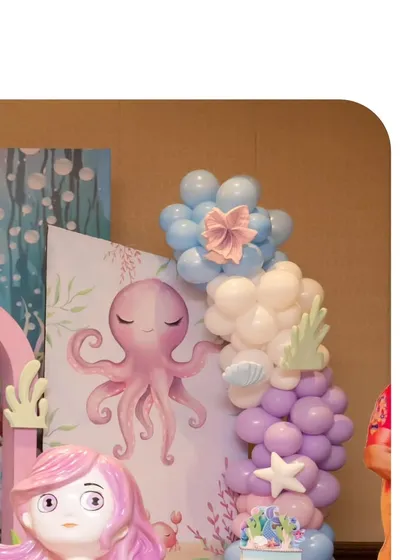 An adorable octopus prop and a balloon garland with a pink bow detail. Every little element is designed to be charming and delightful.