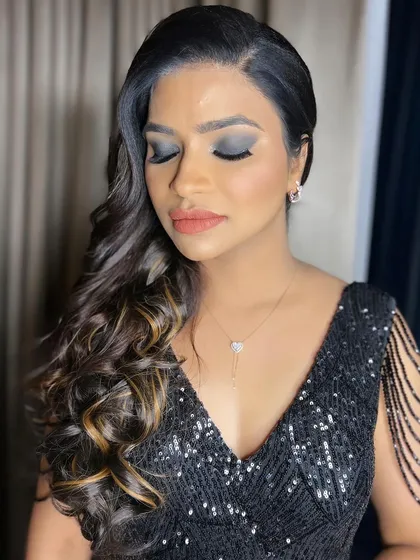 For a glamorous cocktail night, nothing beats a classic smokey eye. I created this bold, elegant look with blended black and grey shadows and a soft nude lip, perfect for a bride who wants to make a statement.