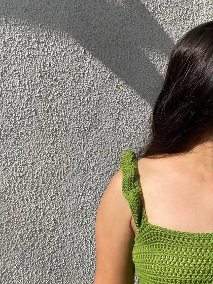 A close-up shot of the ruffle detail on the shoulder strap. It's these small, handmade touches that make our pieces special.