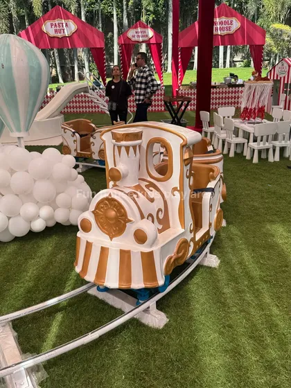 Our elegant white and gold Fun Express train, a centerpiece attraction perfect for circus, carnival, or royal-themed birthday parties. This ride is a guaranteed hit, providing magical moments for children as it circles the track.