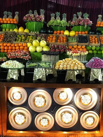 A look at one of our vibrant, market-style fruit counters. I source a wide variety of fresh, high-quality fruits, presenting them beautifully to offer a healthy and colorful option for your guests.