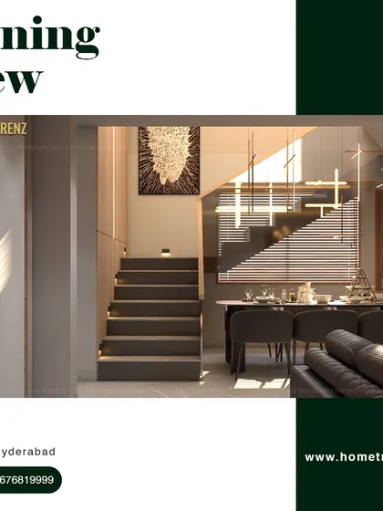 A dining space set against a modern staircase. The design uses the vertical space to create a dramatic and sophisticated atmosphere.