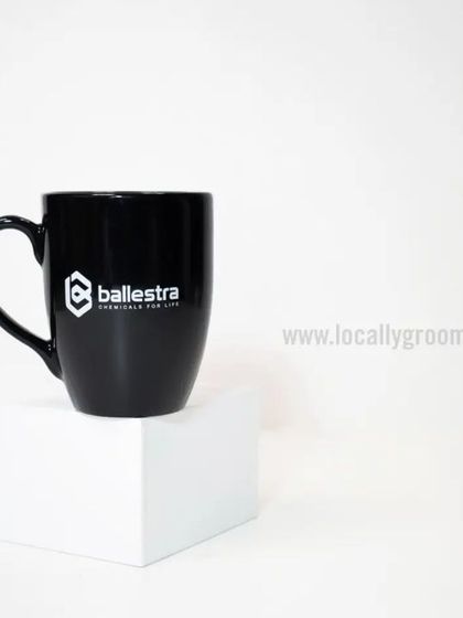 A classic black ceramic mug with a clean white logo for Ballestra. This simple and bold design is always a professional choice.
