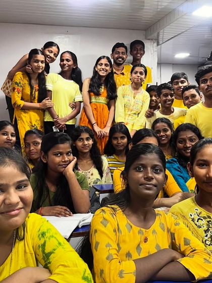 Another cheerful group of students kicking off the Navratri 2024 festival in bright yellow.