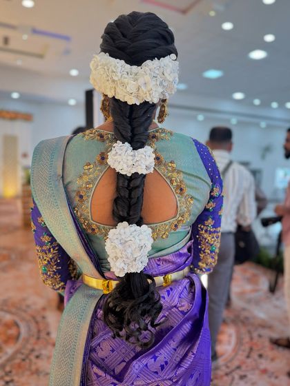 A unique and creative take on the traditional floral braid. For my bride Abi's reception, I used jasmine flowers to create beautiful heart shapes along the length of her braid.