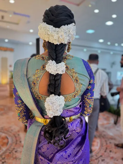 A unique and creative take on the traditional floral braid. For my bride Abi's reception, I used jasmine flowers to create beautiful heart shapes along the length of her braid.
