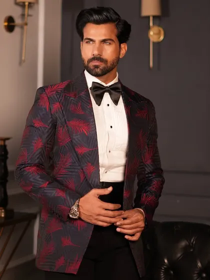 A closer view of the patterned tuxedo, highlighting the texture of the fabric and the crisp white shirt pairing.