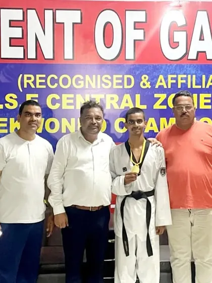 Celebrating Ansh Sharma's gold medal win at the CBSE Central Zone championship with officials. It's a proud moment for the entire academy.