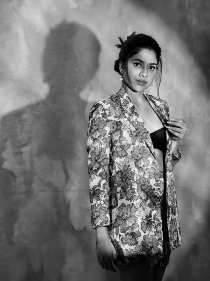 Another artistic black and white photo, playing with shadows. This creates a moody and high-fashion feel.