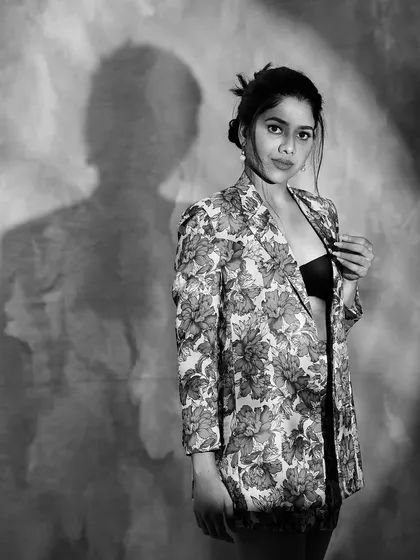 Another artistic black and white photo, playing with shadows. This creates a moody and high-fashion feel.