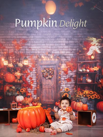 A pumpkin delight! This little one is enjoying the cozy autumn atmosphere of our pumpkin patch theme, a perfect setting for seasonal photos.