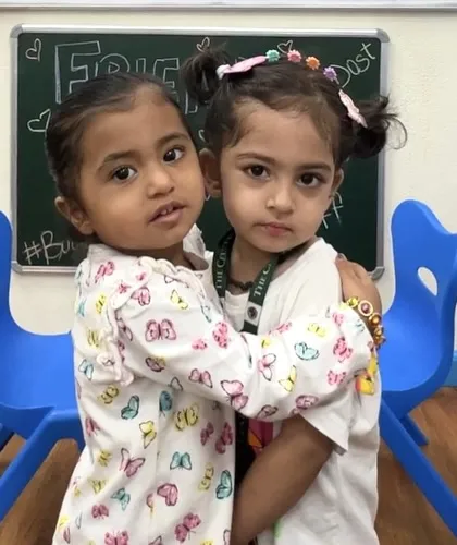 A warm hug between friends. We foster a nurturing environment where children learn to express affection and build strong, positive relationships with their peers.