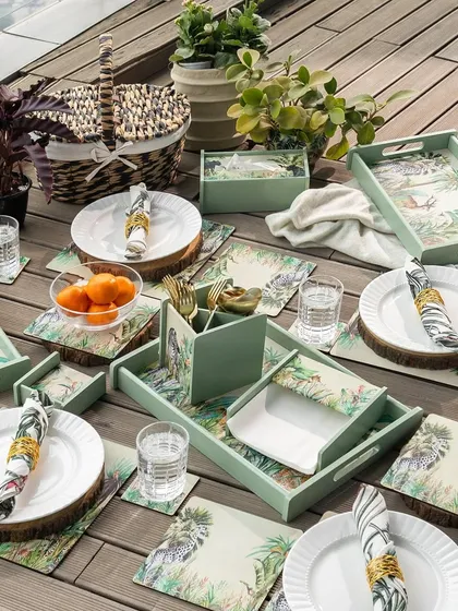 We create cohesive lifestyle collections that bring a theme to life. This outdoor tablescape features our Savanna-themed series, including matching placemats, trays, and napkin holders, perfect for creating a sophisticated and coordinated hosting experience.