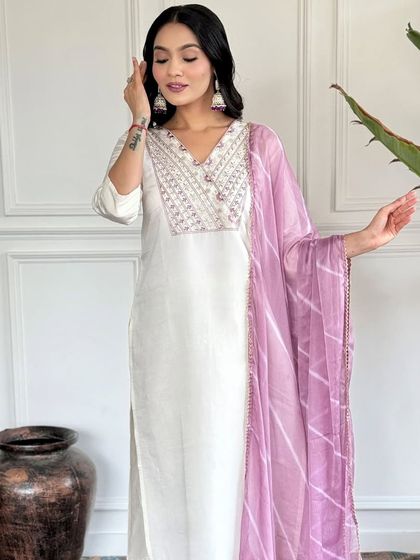 An elegant white chanderi kurta paired with a beautiful printed lavender dupatta. It's a classic combination that's perfect for a sophisticated, graceful look.