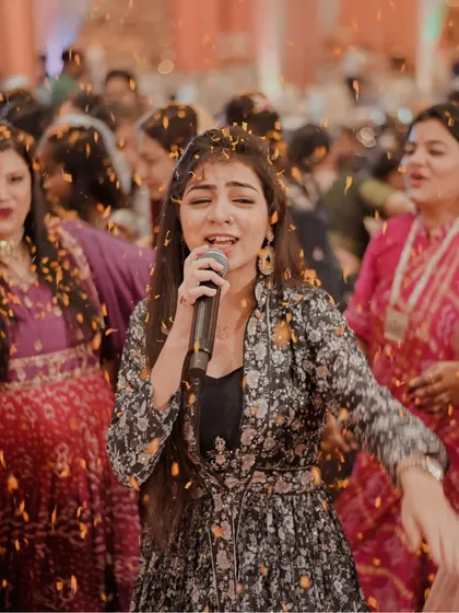 A throwback to a Maayra event in Raipur, with flower petals showering down as I sing. The energy of the crowd was infectious.