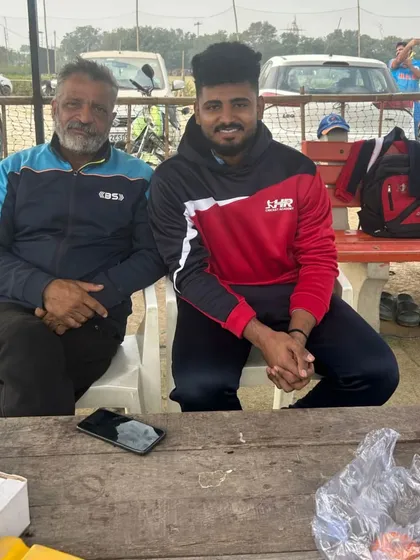 A photo with one of my senior players. It's a privilege to guide these young men on their cricket journey.