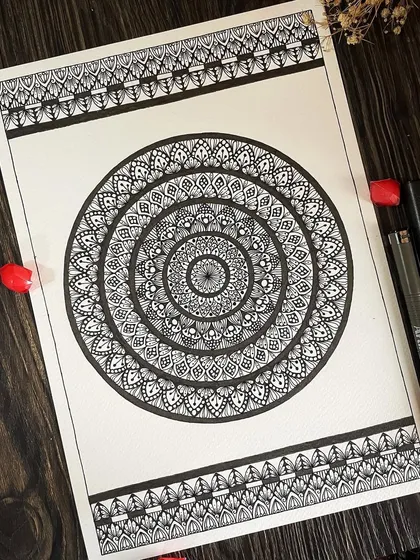 This large black and white mandala features decorative borders that frame the central design. It's a classic, full-page artwork on 300 GSM paper that makes a bold statement of elegance and complexity.
