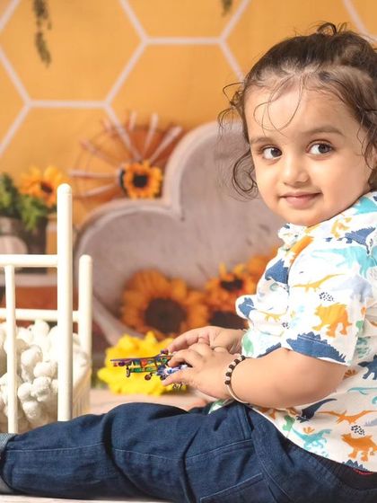 A collection of candid and playful moments from a sunflower-themed session, showing a range of expressions from curious to joyful.