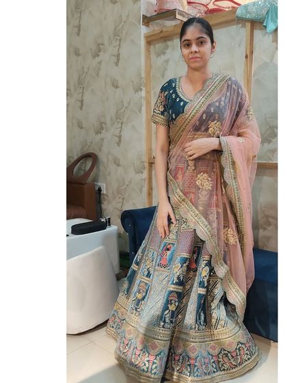 A client trying on the unique Doli Barat lehenga in the studio. It's a great choice for someone who wants a story in their outfit.
