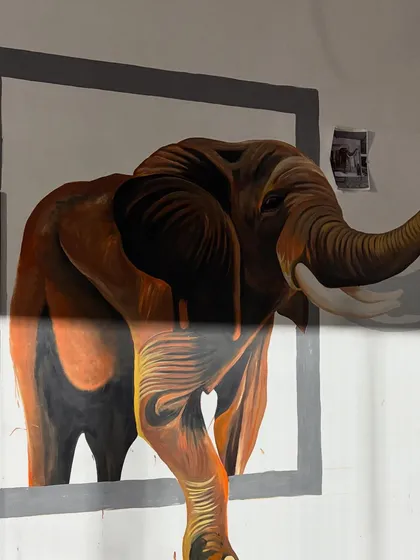 Another progress shot of the elephant, with the reference photo taped to the wall.