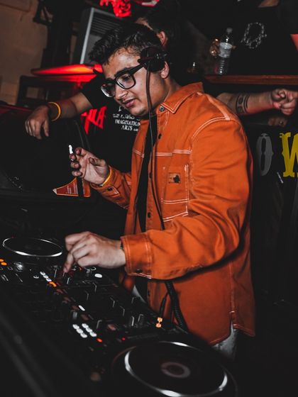 Adjusting the mix during my Halloween performance. Themed nights often call for special tracks and edits to match the mood.