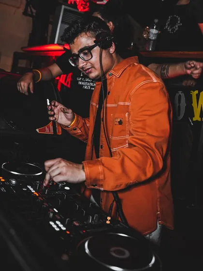 Adjusting the mix during my Halloween performance. Themed nights often call for special tracks and edits to match the mood.