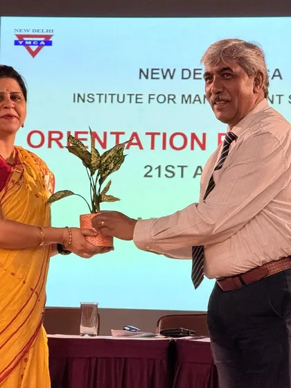 A moment of felicitation where our Chief Guest is presented with a plant, symbolizing the growth and new beginnings our orientation day represents for students.