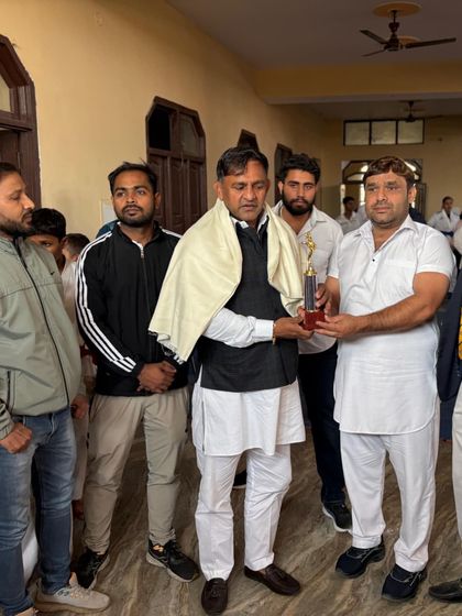 Presenting a trophy at a felicitation ceremony. I believe in giving back to the sport by encouraging and honoring upcoming talent.