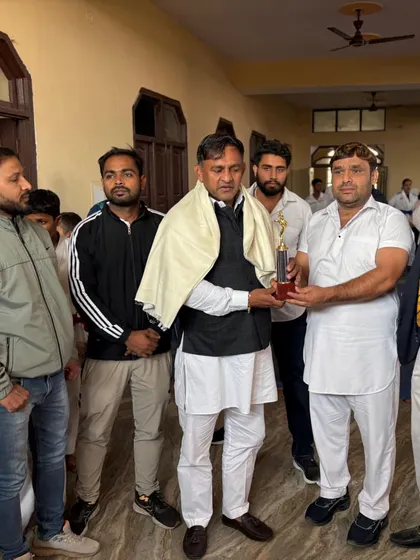 Presenting a trophy at a local championship. It is my duty to encourage and recognize the hard work of all athletes.