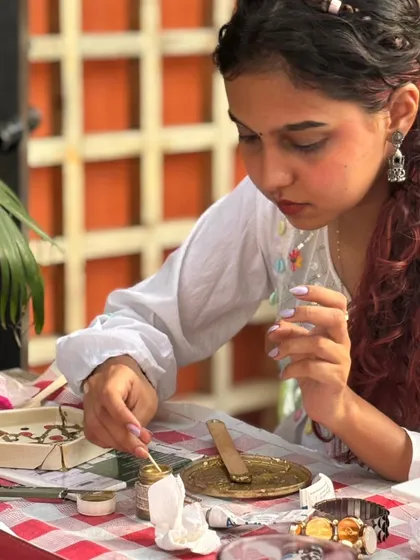 A participant fully immersed in her craft. Our workshops are a ritual of shared creativity.